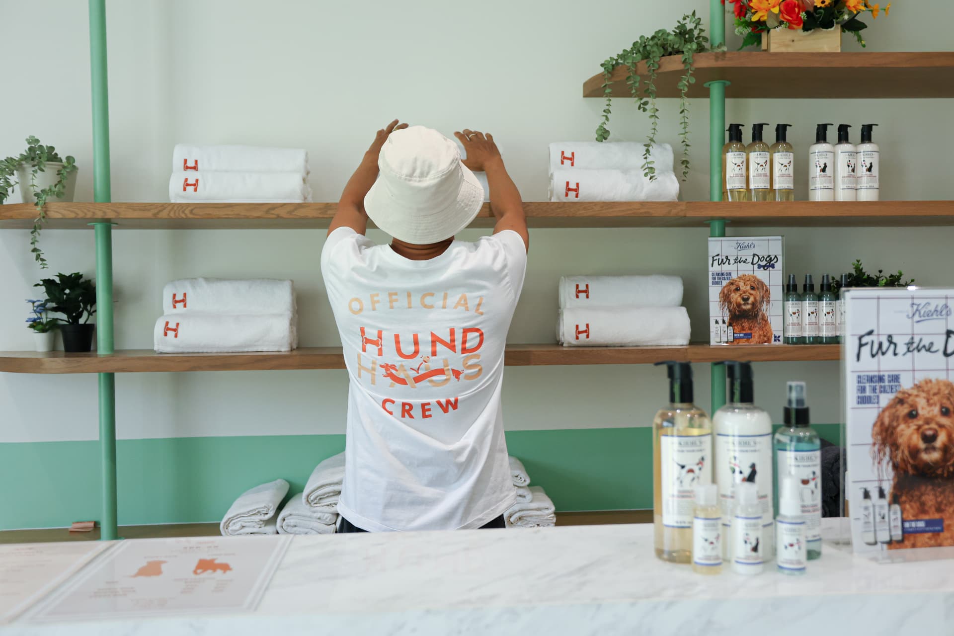 HUND HAUS crew member stocking towels and shampoo
